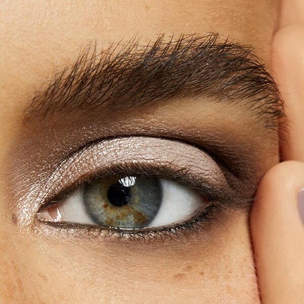 Close up of model eyes showcasing eyeshadow and mascara application